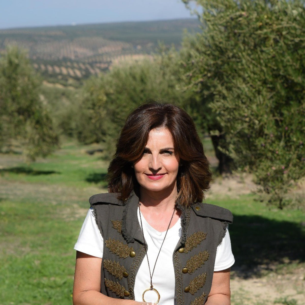 Lola Sagra of Nobleza del Sur standing in an olive grove